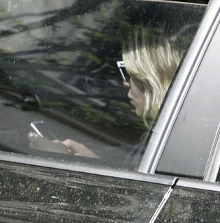 Guess Who Is Checking Her Text Messages? 